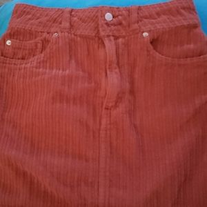 Skirt Made from a soft + supple wide-ribbed cordur